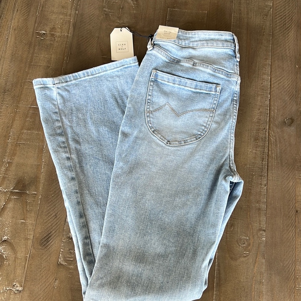 CLEO + WOLF SOUTH COAST HIGH-RISE LIGHT WASH STRETCH BOOTCUT JEANS